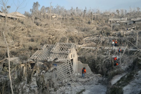 Indonesian search and rescue teams explore the area after Mount Merapi volcano erupted the night before in the village of Pakem in Sleman, Yogyakarta province on October 27, 2010. (CLARA PRIMA/AFP/Getty Images) #