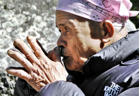 This file photo taken on May 17, 2006 shows Mbah Marijan, the appointed guardian for Mount Merapi by Yogyakarta's highly respected Sultan Hamengkubuwono X as he prays for the people's safety in Kinahrejo. Marijan was one of the victims of the eruption. Grandfather Marijan was found dead - reportedly discovered in a prayer position - inside his burnt house about four kilometers (2.5 miles) from the peak, local officials said.(Tarko SUDIARNO/AFP/Getty Images) #